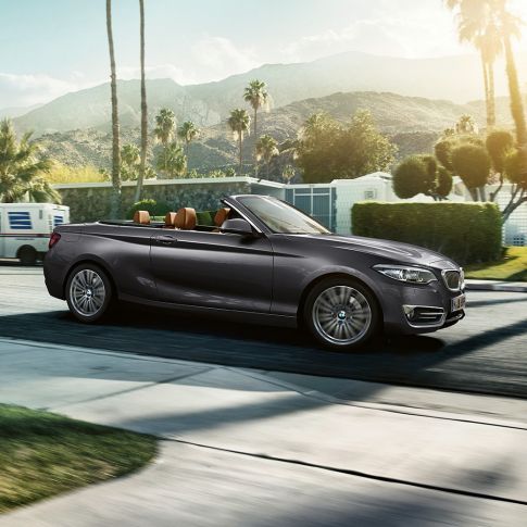 BMW 2 Series Convertible, driving shot from the side BMW 2 Series Convertible, driving shot from the side