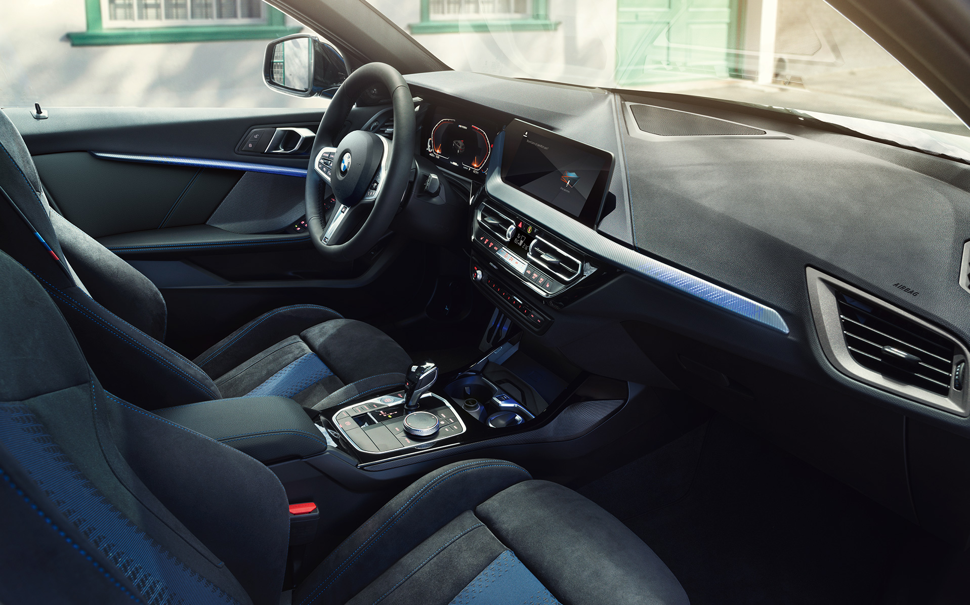 Sporty BMW 1 Series F40 interior BMW 1 Series F40 cockpit with M Sport seats, M Leather steering wheal and illuminated interior trim finishers