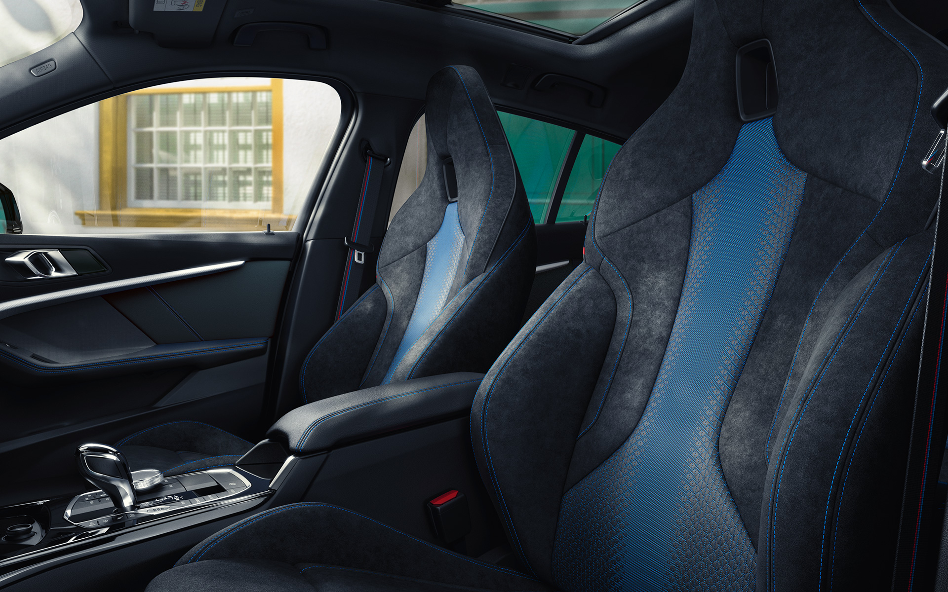 Ergonomically shaped M Sport seats in the BMW 1 Series F40 with contrast stitching and integrated headrest.