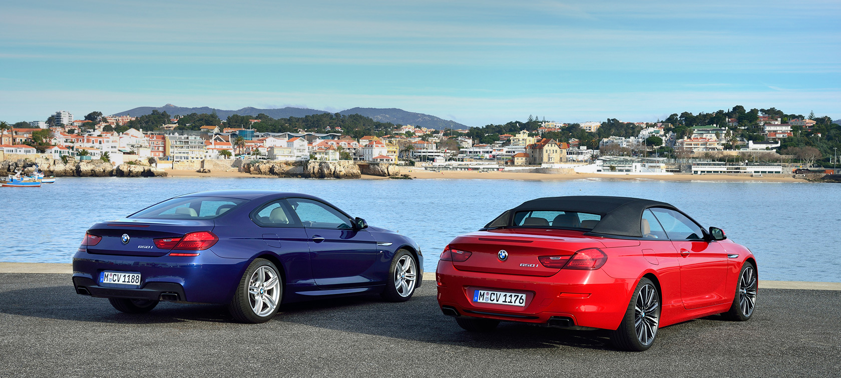 BMW 6 Series models three-quarter rear view BMW 6 Series models three-quarter rear view in front of beach