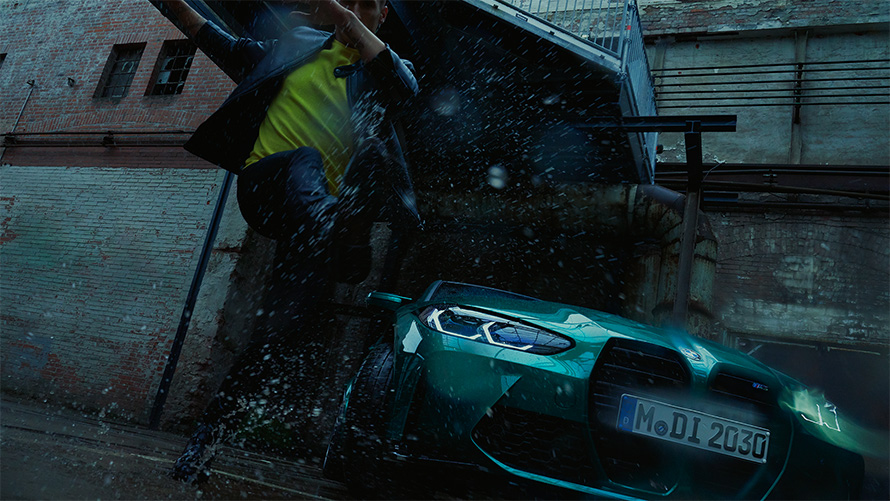 BMW M3 Sedan G80 2020 Isle of Man Green metallic front view with man in the rain