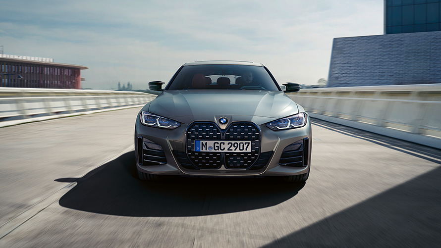 BMW M440i xDrive Gran Coupé G26 2021 front view on the road BMW M440i xDrive Gran Coupé G26 2021 Frozen Pure Grey metallic front view on the road