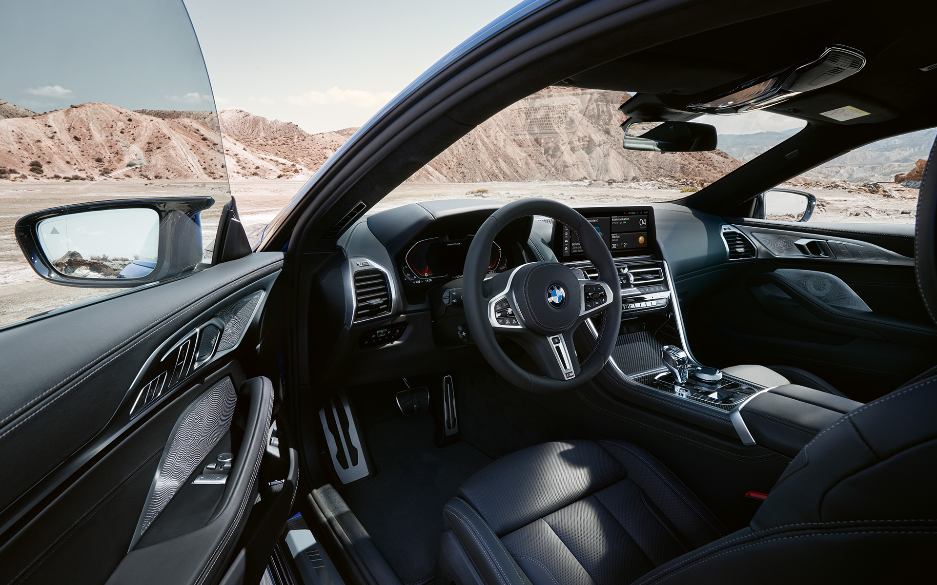 BMW M850i xDrive Coupé G15 LCI Facelift 2022 Driver-oriented cockpit with M leather steering wheel with open front door