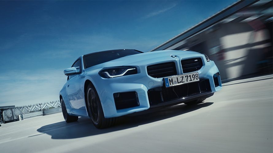 BMW M2 G87 front view dirivng on the street BMW M Series BMW M2 G87 front view dirivng on the street