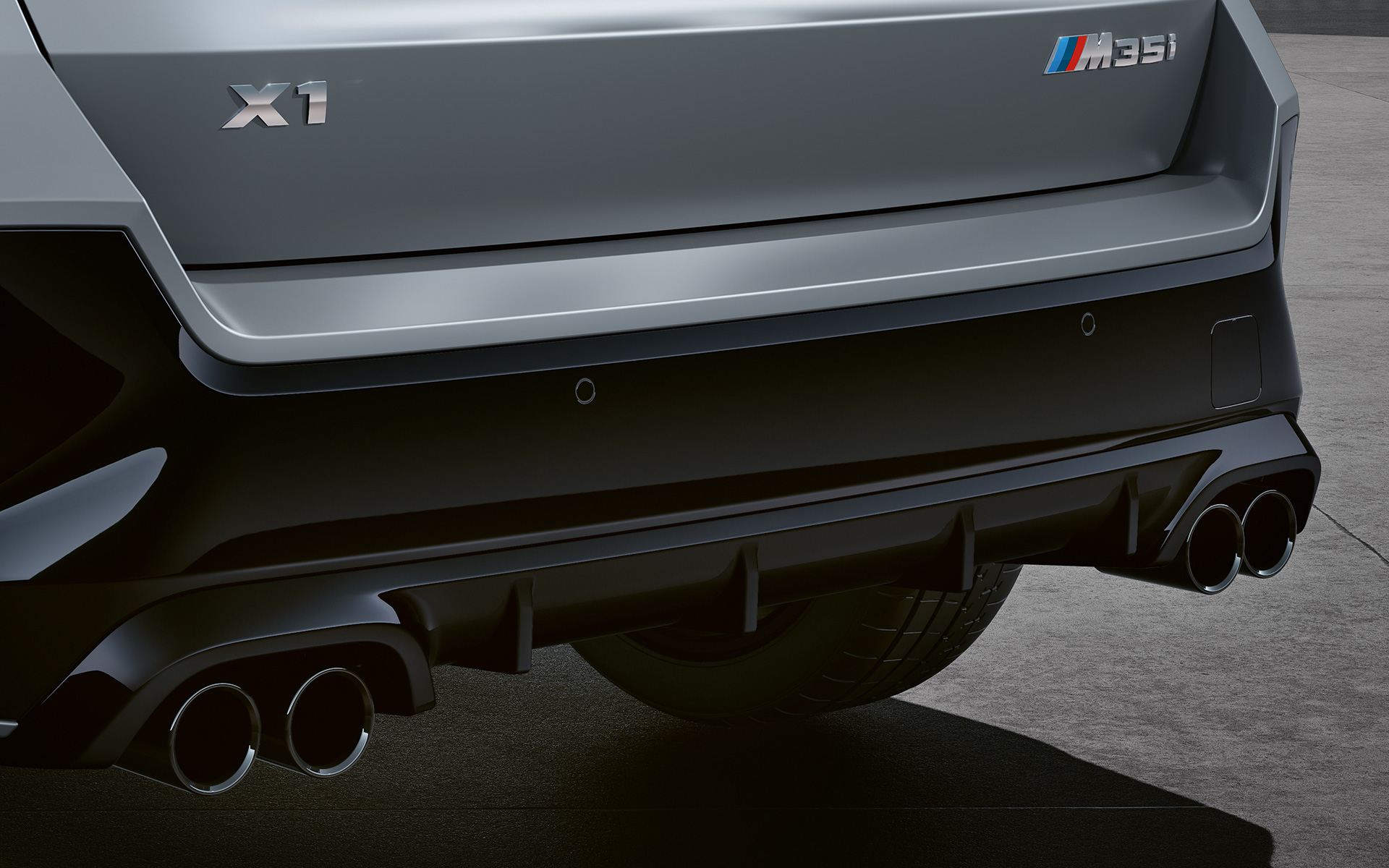 BMW X1 M35i xDrive Exterior detail tailpipes