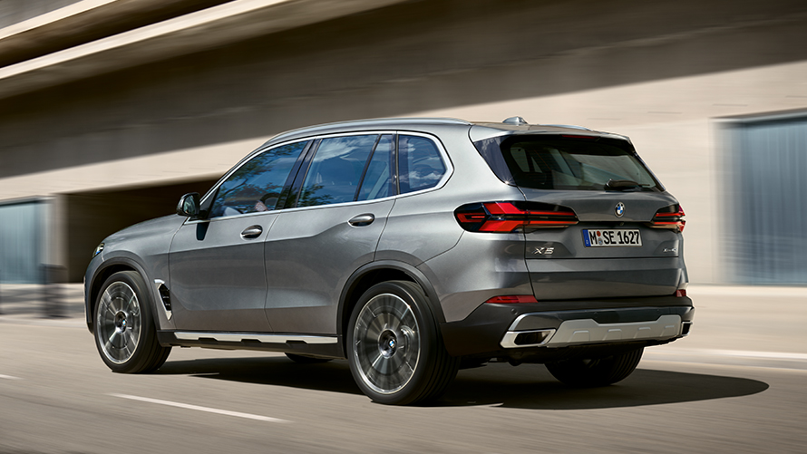BMW X5 G05 fifth generation three-quarter rear view BMW X Series BMW X5 G05 fifth generation three-quarter rear view driving on the street