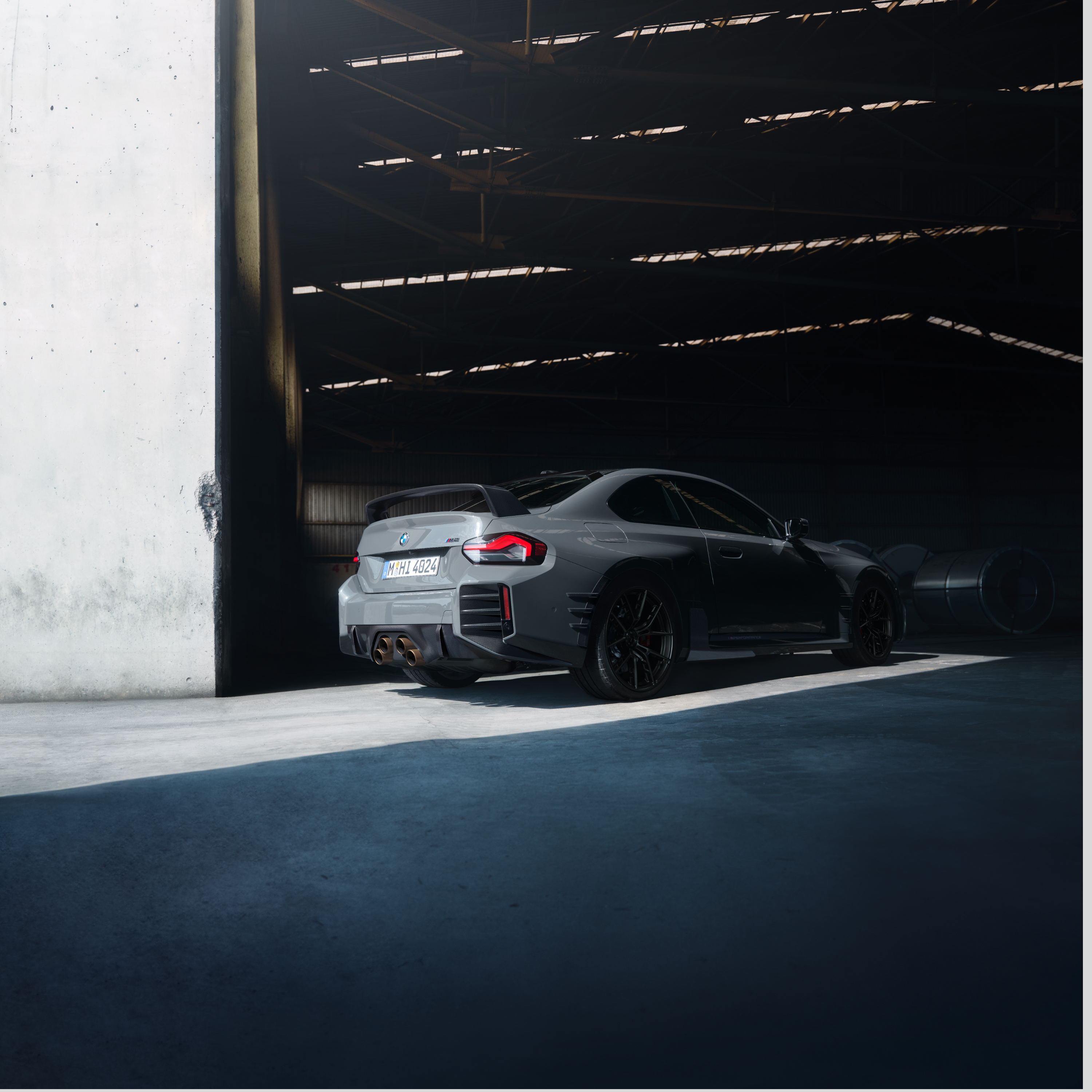 BMW stands at the gate of a large hall